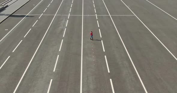 Aerial View, Roller Skating Slalom, Criss Cross. Girl Is Rollerblading in the Open Area. , 10Bit