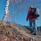 Tourist Woman Goes Hiking Up Hill - VideoHive Item for Sale