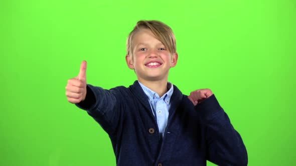 Baby Boy Shows Thumbs Up. Green Screen. Slow Motion