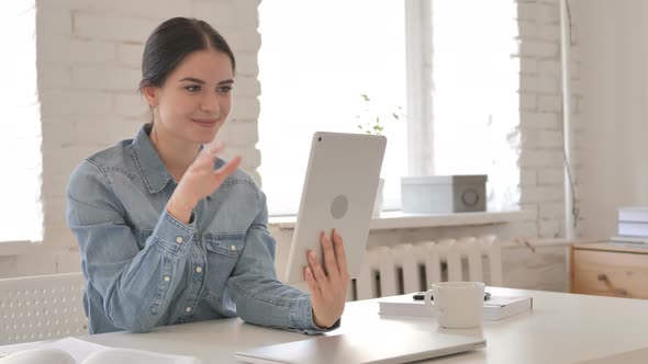 Online Video Chat on Tablet by Young Girl