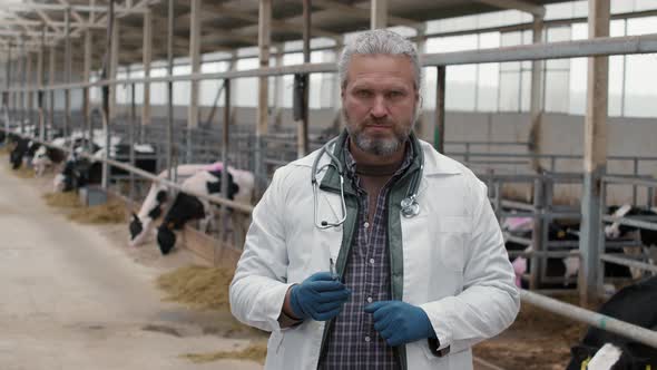 Male Veterinarian Posing at Dairy Farm