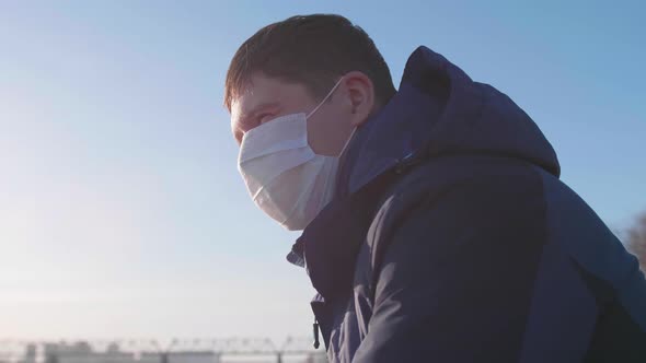 Guy in a Protective Mask on the Street. Prevention and Protection of Health and Life Safety.