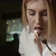 Beautiful Blonde Girl Eats Deliciously Sitting in a Restaurant - VideoHive Item for Sale