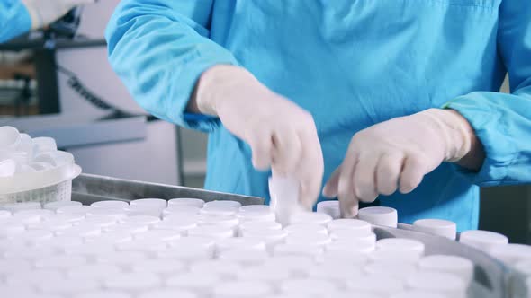 Pharmacology Worker is Sorting Unlabeled Pill Jars