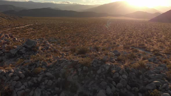 Aerial Dolly Forward of Desert Valley in Anza Borrego State Park During Sunset