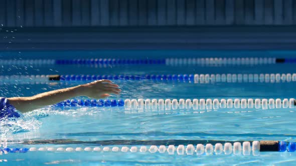 Female swimmer swimming inside pool 4k