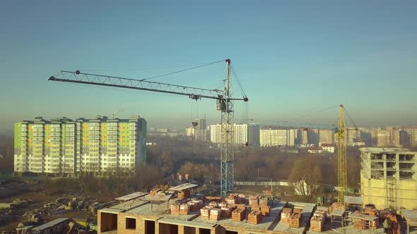 Aerial view of tall residential apartment buildings under construction.