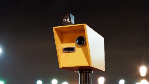 Speed camera takes photos with the flash at night. Speed control at the road.