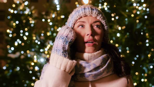 Happy Woman Calling on Smartphone on Christmas