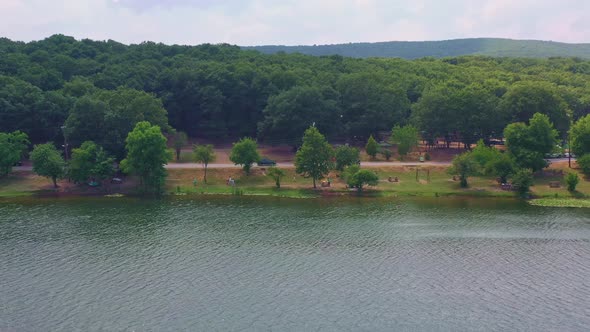 aerial shot of picnic place in lake and forest