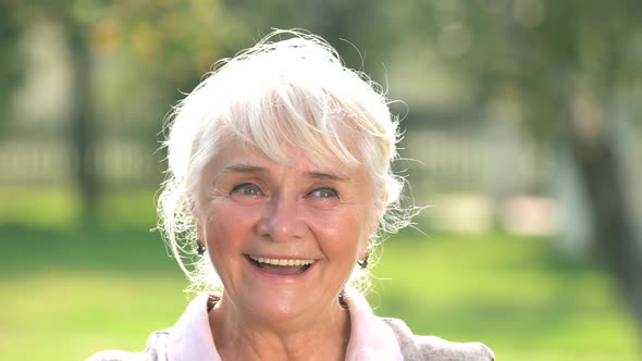 Thoughtful Senior Woman Smiling.