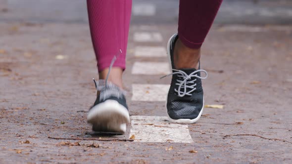 Closeup Legs of Ethnic Woman Runner in Sneakers