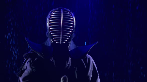 Portrait of a Japanese Kendo Fighter Lowering His Shinai Towards the Camera