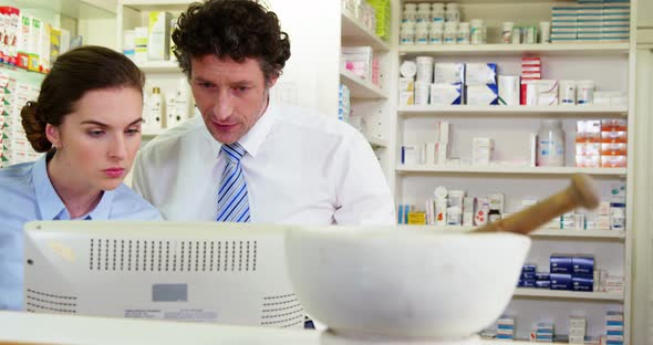 Pharmacists working at counter