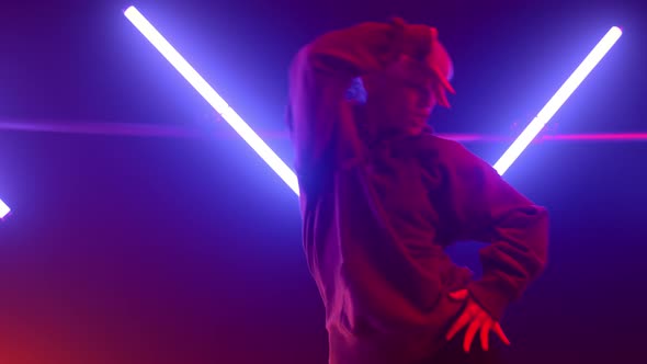 Girl Hiphop Dancer Moving Body Emotionally in Ultraviolet Backlit Close Up