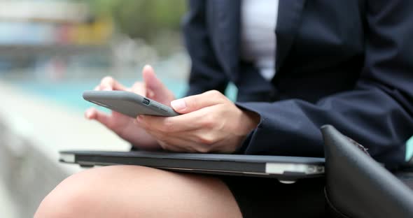Businesswoman use cellphone at outdoor