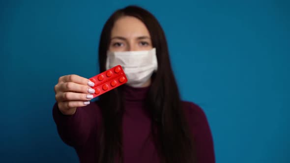 Woman Presenting a Hand Pills