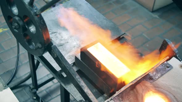 Industrial Burner is Roasting Copper in the Mold