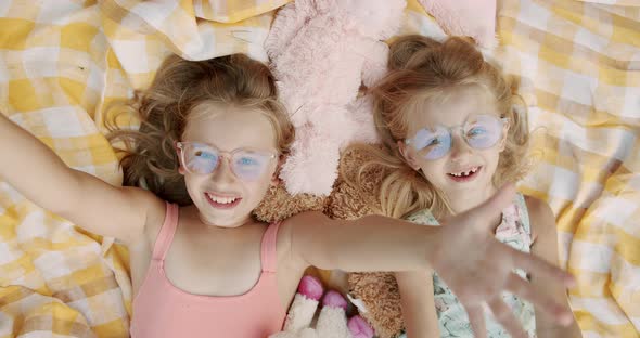 Unexpected Surprise Little Girls Smiling with Glasses Looks to Camera Holidays