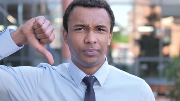 Thumbs Down by African Businessman, Outdoor