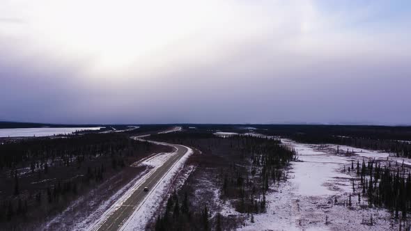 Car on Parks Highway in Winter