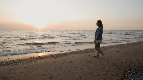 Young Woman Enjoys Summer Sunset at Sea