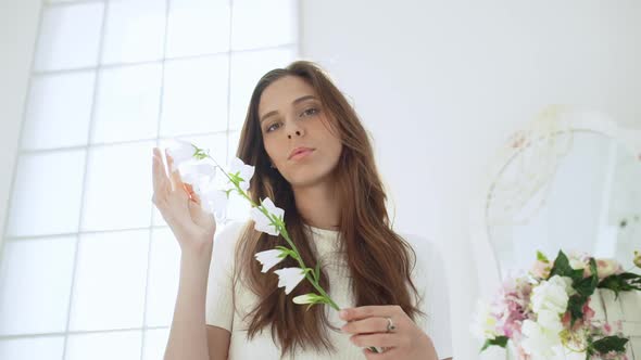 Young Beautiful Girl in White Decor