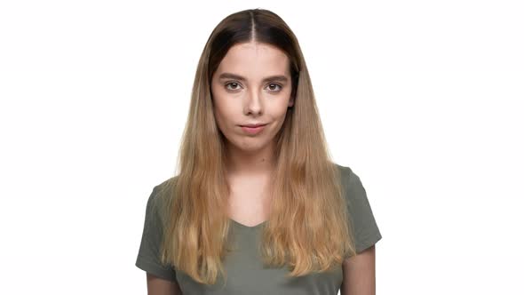 Portrait of Determined Pleased Woman Wearing Basic Tshirt Nodding and Accepting Proposal Isolated