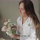 Woman Arranging Flowers at Table - VideoHive Item for Sale