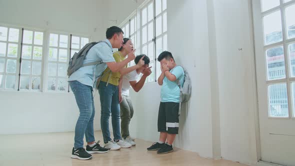 Young Asian Students Bullying Little Boy