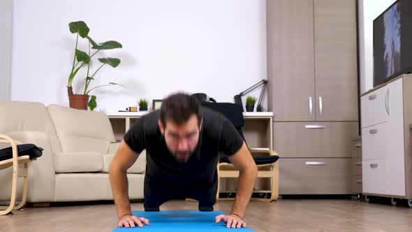 Athletic Man Doing Push Ups At Home