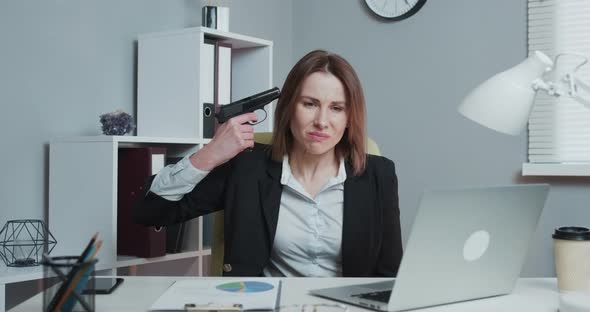 Depressed Business Woman Taking a Gun to Her Temple and Trying to Kill Herself