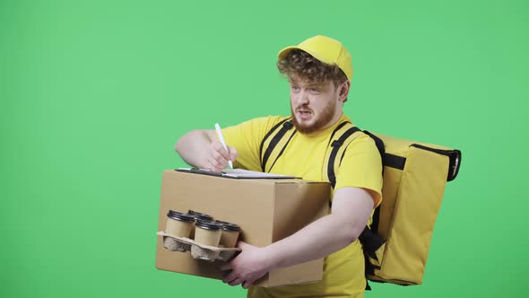 Portrait of Young Men Fills Out Delivery Documents Holding Parcel and Coffee