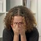 Teenage Girl Sits Alone and Cries Covering Her Face with Her Hands - VideoHive Item for Sale