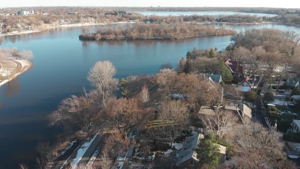 Aerial footage of lake of the isles and lake Calhound, Minneapolis, MN, during a sunny afternoon