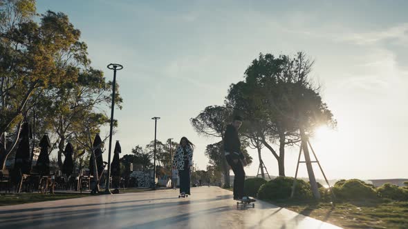 Hipster Couple Skateboarding