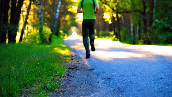 Sport Man Running at Asphalt Road