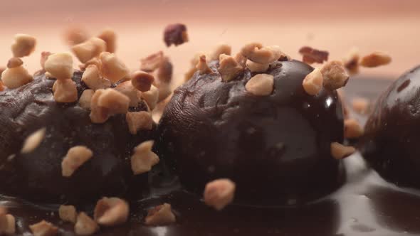 Nuts pouring onto chocolate truffles in super slow motion.  Shot on Phantom Flex 4K high speed camer