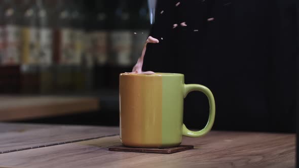 Throwing a Sugar Cube in a Cup of Coffee