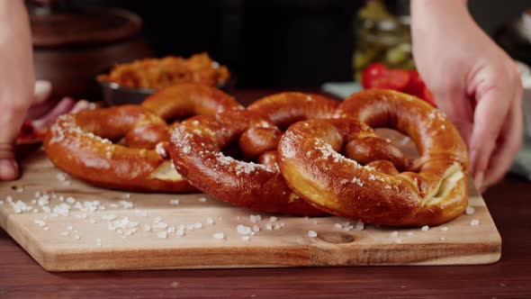 Putting Fresh Pretzels on Table Top View