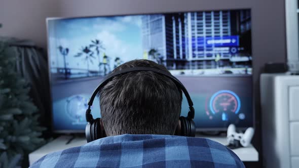 Focused man playing video game.