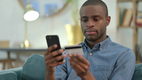 Online Shopping on Smartphone By African Man