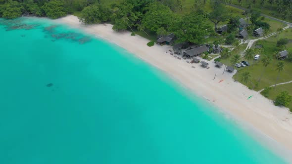 Port Orly sandy beach with palm trees, Espiritu Santo Island, Vanuatu