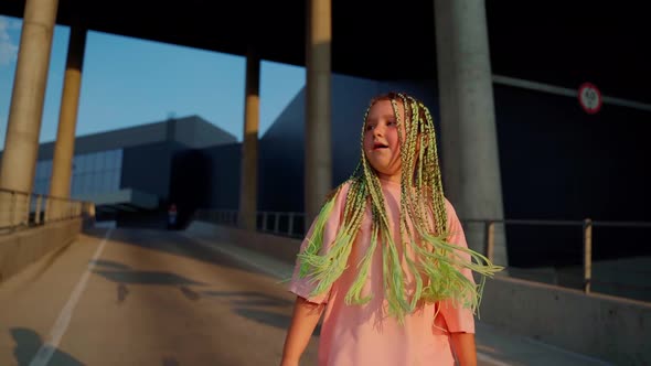 Young girl dancer dancing hip hop at car parking close up. Urban dancing freestyle in the city