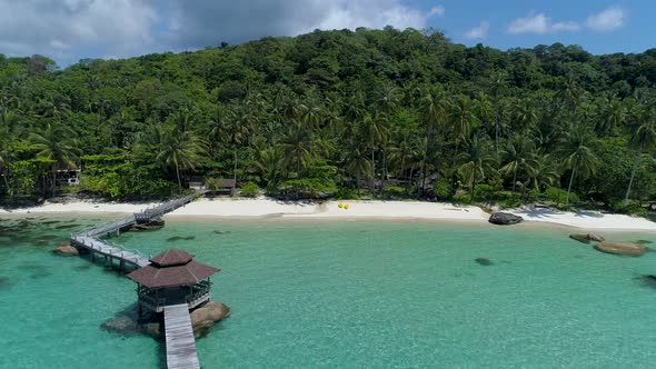 Aerial of a perfect tropical private beach in Asia. opening scene drone shot