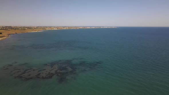 Cyprus beach at daytime. Mediterranean Sea. Beautiful views of the coast. Larnaca District.