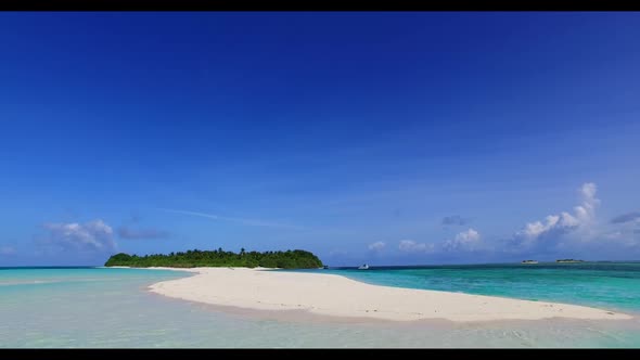 Aerial above seascape of tranquil coast beach adventure by blue sea with white sand background of a 