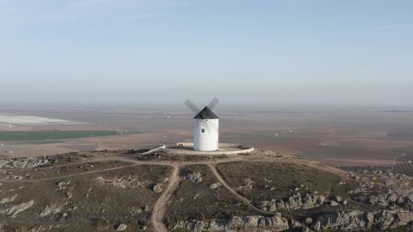 From above white windmill on field