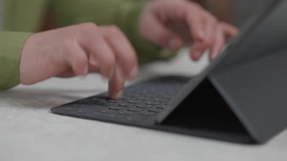 Male Fingers Texting on Tablet Keyboard Closeup