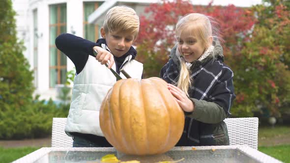 Children Carving Pumpkin Jack-O-Lantern, Excited With Process, Happy Emotions